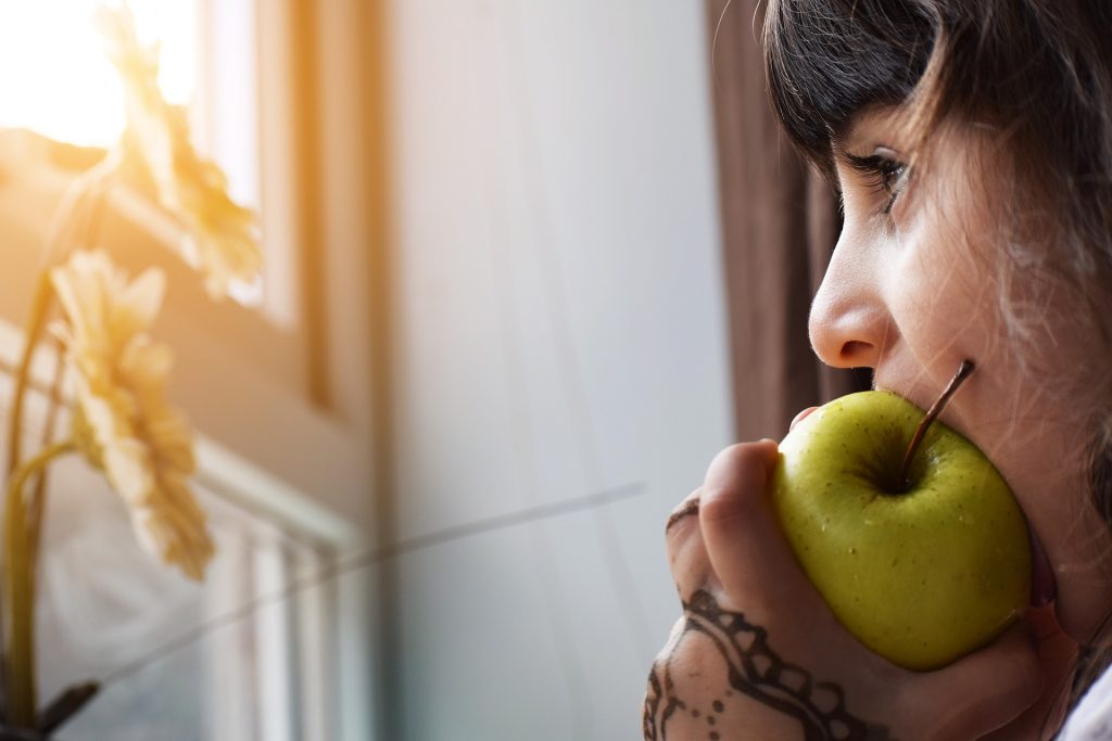 Girl eating a apple