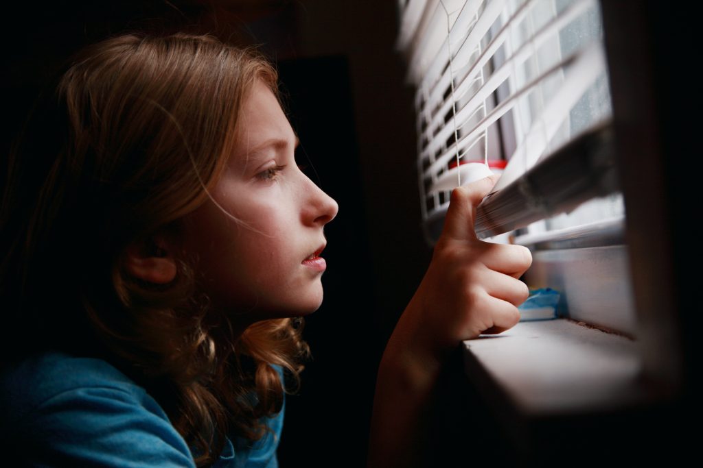 Girl looking out the window